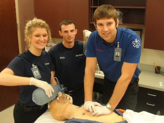 EMS Students administering CPR on SIM man