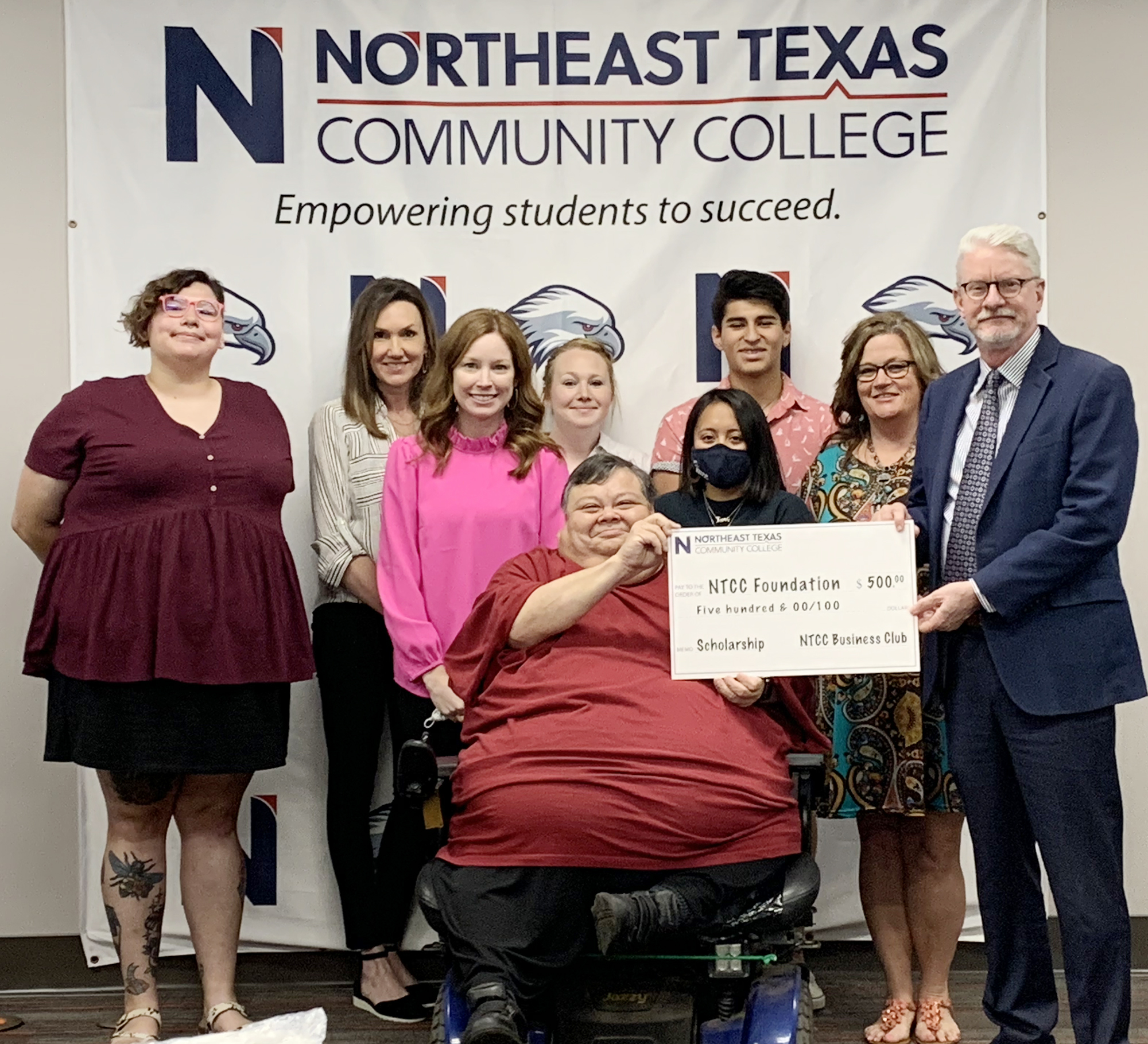 business club presents scholarship to president