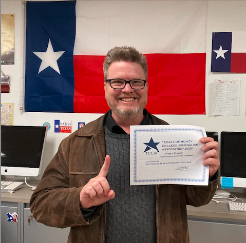 Ian Griffin with award