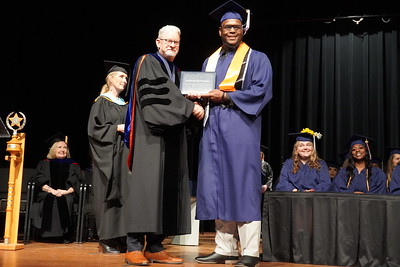 graduate receiving diploma