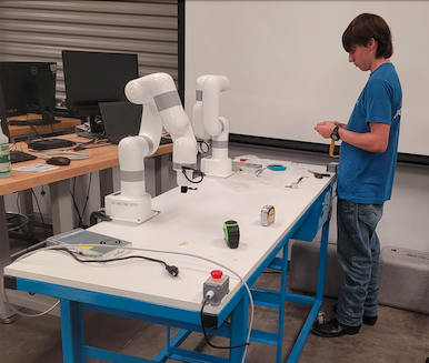 Daniel Harvey installing robotic arms