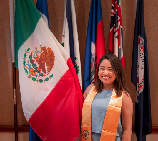 monse in front of flags