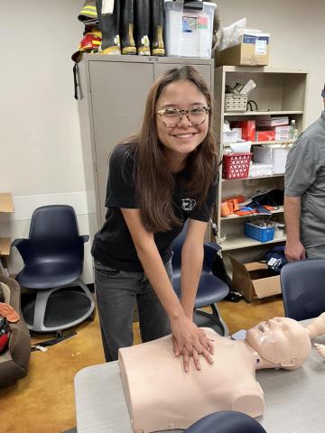 student learning CPR