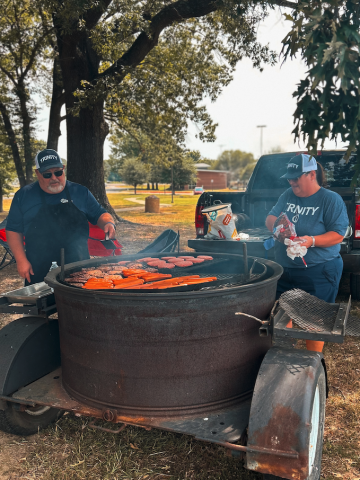 people cooking burgers