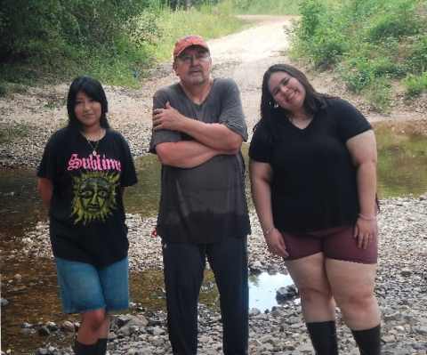 three researchers at river