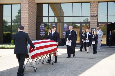 students conduct mock funeral