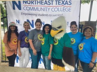 members of student services with the eagle