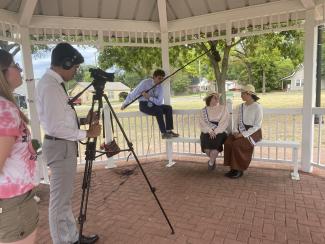 Filming in Caldwell Park, Mount Pleasant.  Left to Right: Raul Leija, Evan Sears, Skylar Hodson as Minnie Fisher Cunningham and Neida Perez.