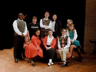 Group Photo of Cast Members on Stage