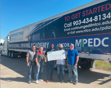 check presentation in front of truck