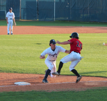 player makes a tag at third for an out