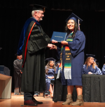 graduate receiving diploma