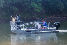 students doing research on boat