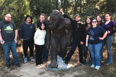 students with bigfoot statue