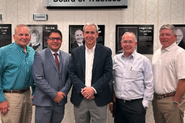 Rose with board members