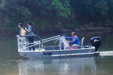 students doing research on boat