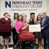 business club presents scholarship to president