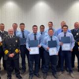 firefighter graduates with instructors