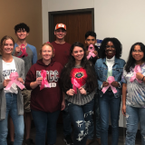PTK students with pink ribbons