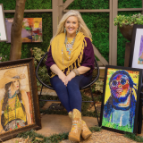 artist with her paintings