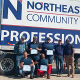 cdl graduates in front of truck