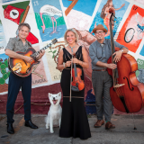hot club of cowtown group photo in front of mural with cute dog
