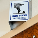 shelter area sign above door