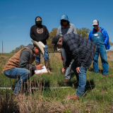 ranchers learning in a field
