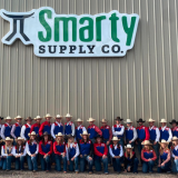 rodeo team in front of Smarty building