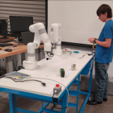 Daniel Harvey installing robotic arms