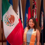 monse in front of flags