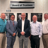 Rose with board members