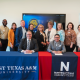 ETAMU signing group photo