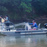 students doing research on boat